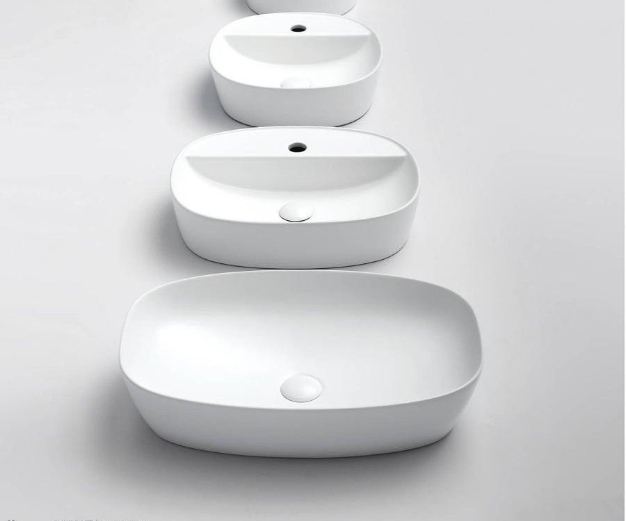 white ceramic bathroom wash basin